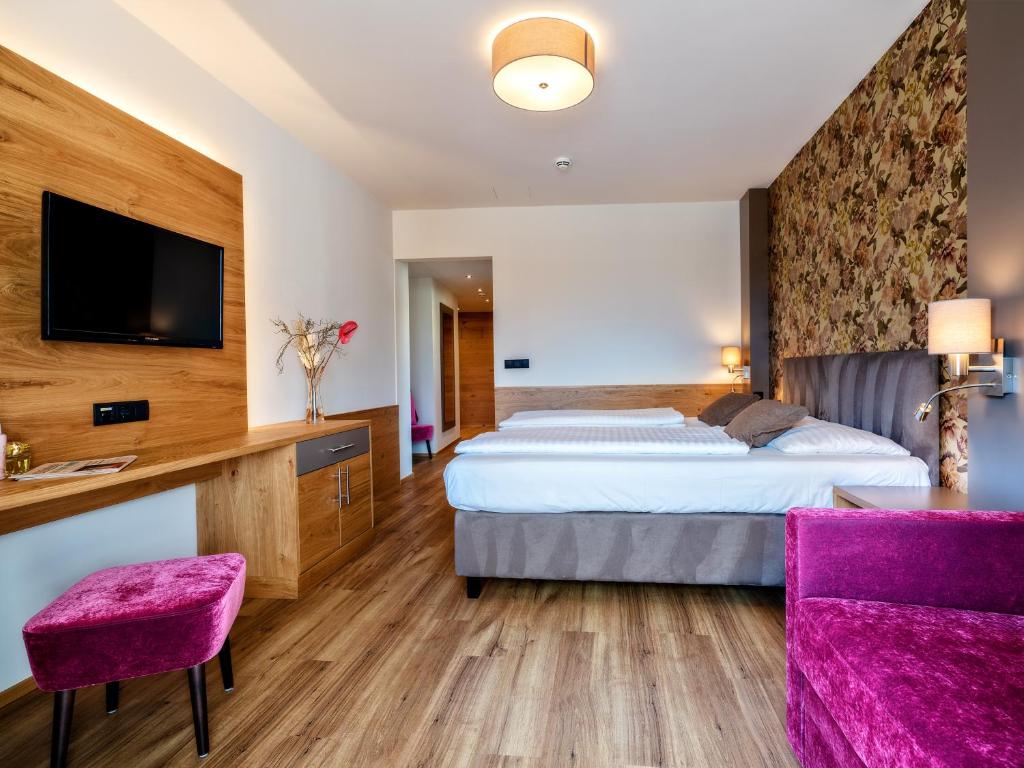Posteľ alebo postele v izbe v ubytovaní Stadthotel EGGERBRÄU
