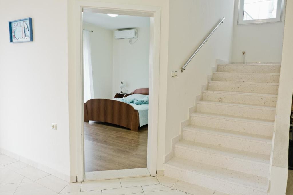 Postel nebo postele na pokoji v ubytování Apartments Klara