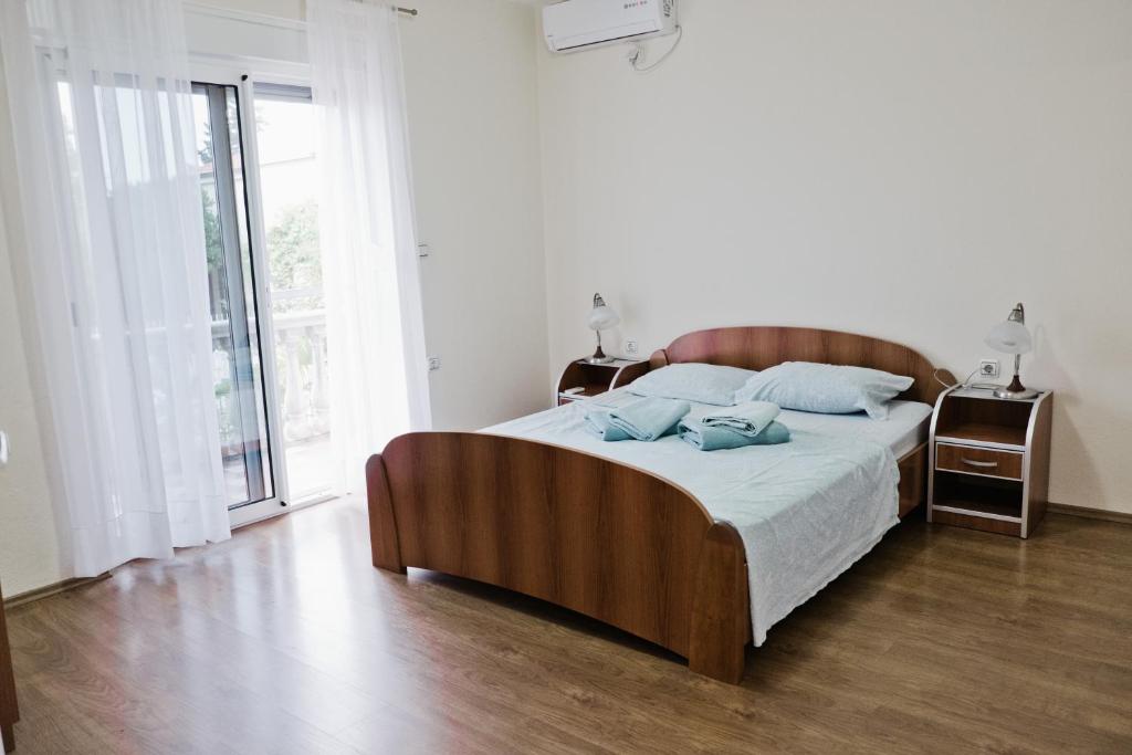 Postel nebo postele na pokoji v ubytování Apartments Klara
