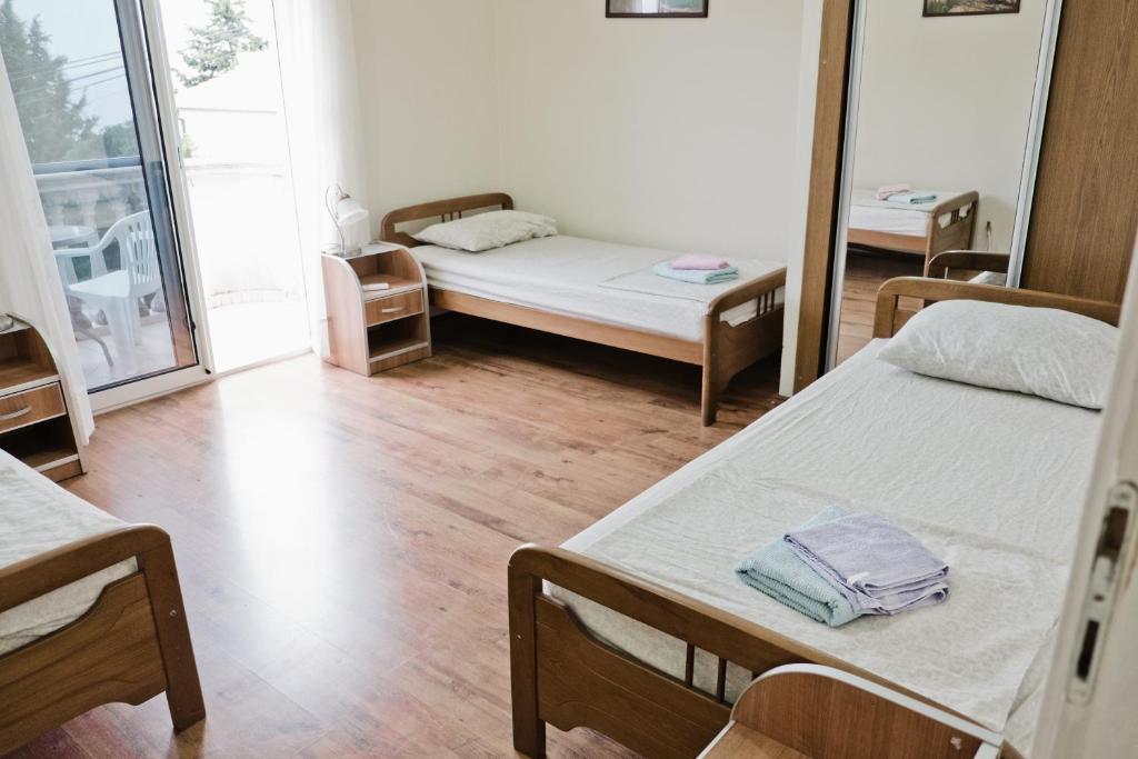 Postel nebo postele na pokoji v ubytování Apartments Klara