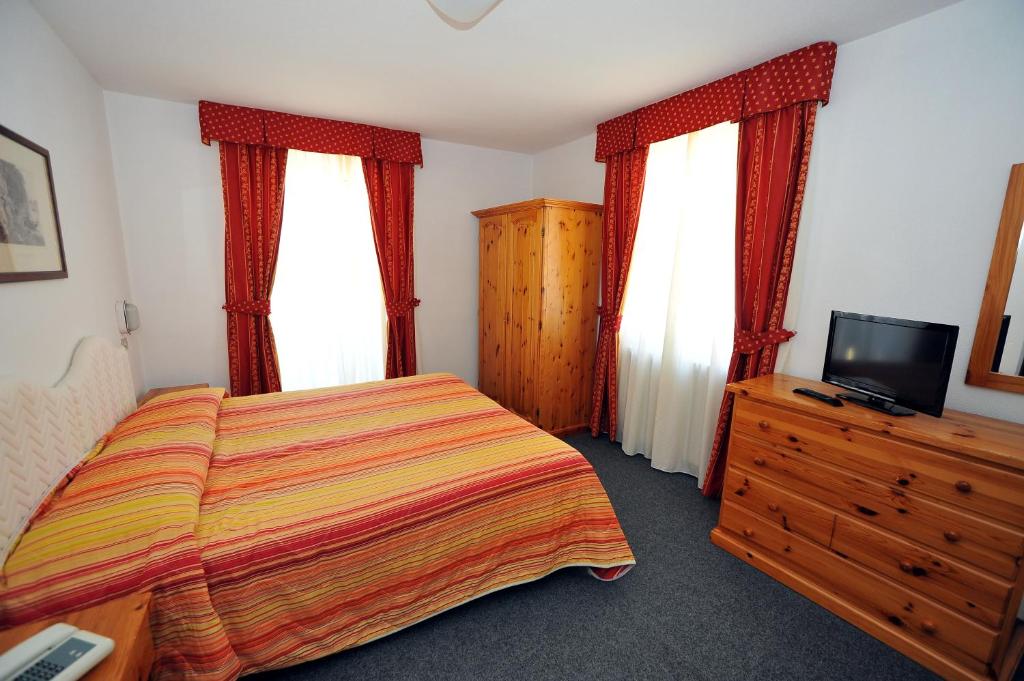 Postel nebo postele na pokoji v ubytování Hotel Capitani
