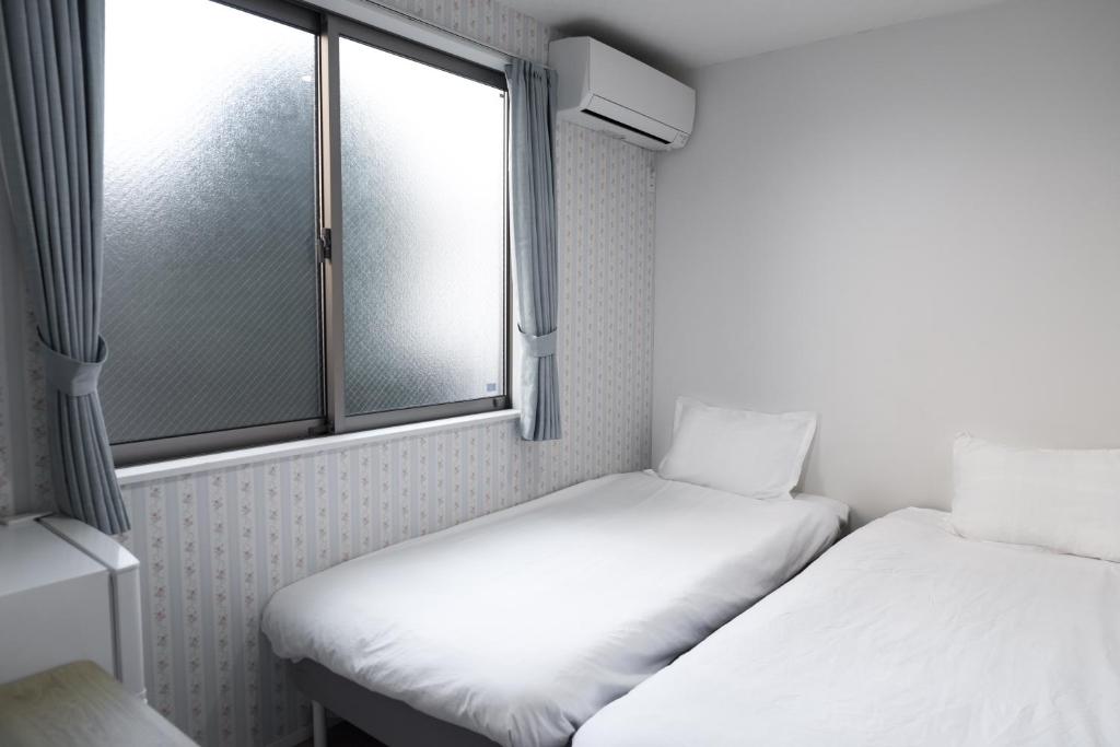 nestay inn tokyo senjuにあるベッド