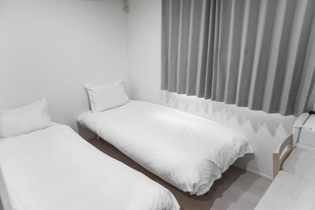 nestay inn tokyo senjuにあるベッド