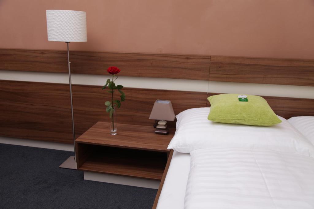 Postel nebo postele na pokoji v ubytování Primus Hotel & Apartments