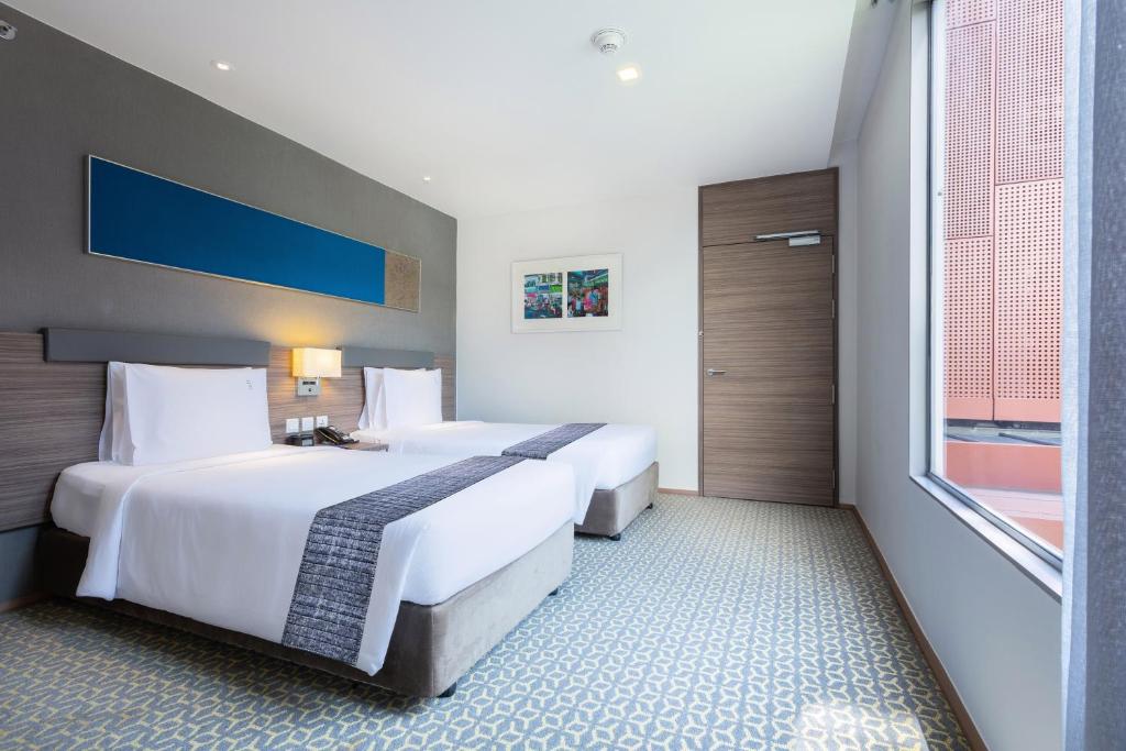 Postel nebo postele na pokoji v ubytování Holiday Inn Express Bangkok Sathorn by IHG
