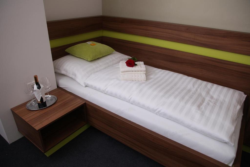 Postel nebo postele na pokoji v ubytování Primus Hotel & Apartments
