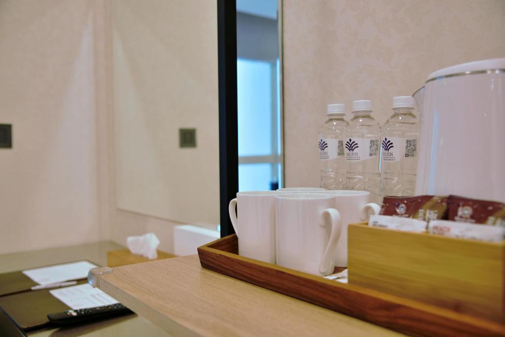 Postel nebo postele na pokoji v ubytování Muen Yuan Dong Hot Spring Hotel