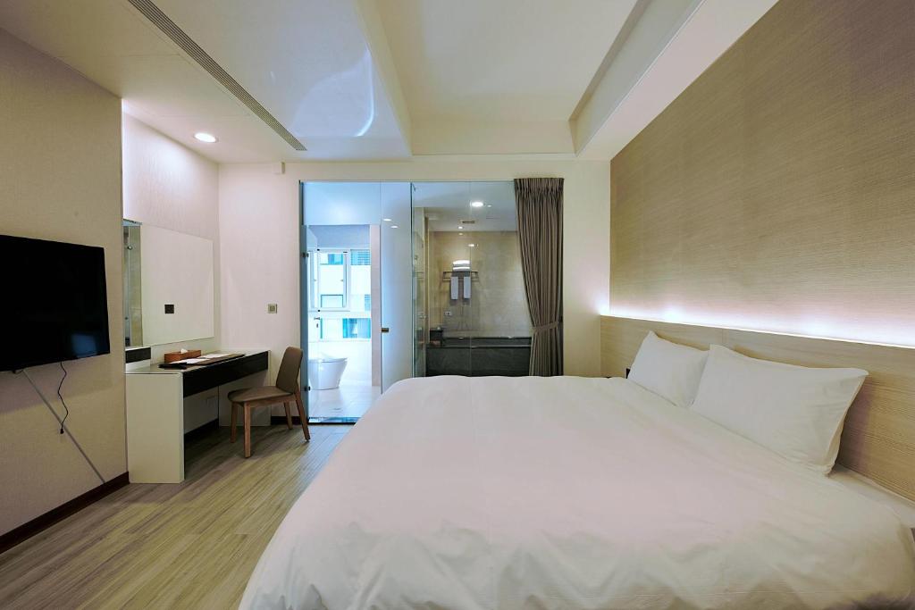 Postel nebo postele na pokoji v ubytování Muen Yuan Dong Hot Spring Hotel