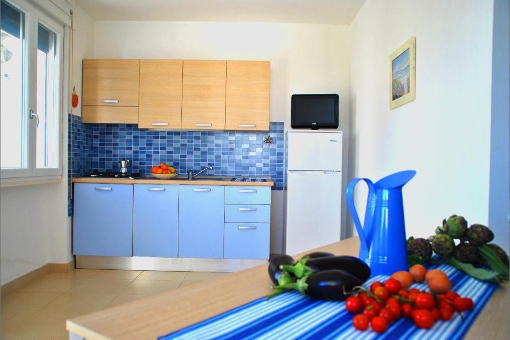 Kuchyň nebo kuchyňský kout v ubytování Residence Le Palme