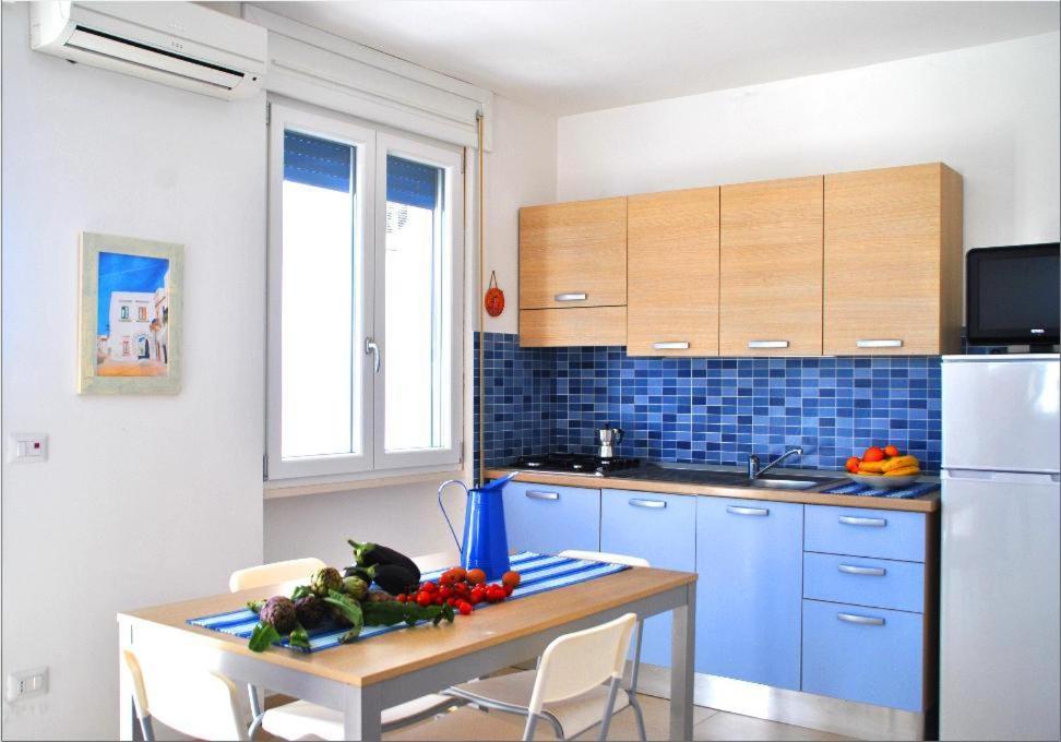 Kuchyň nebo kuchyňský kout v ubytování Residence Le Palme