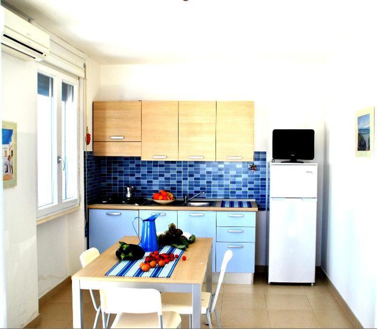 Kuchyň nebo kuchyňský kout v ubytování Residence Le Palme
