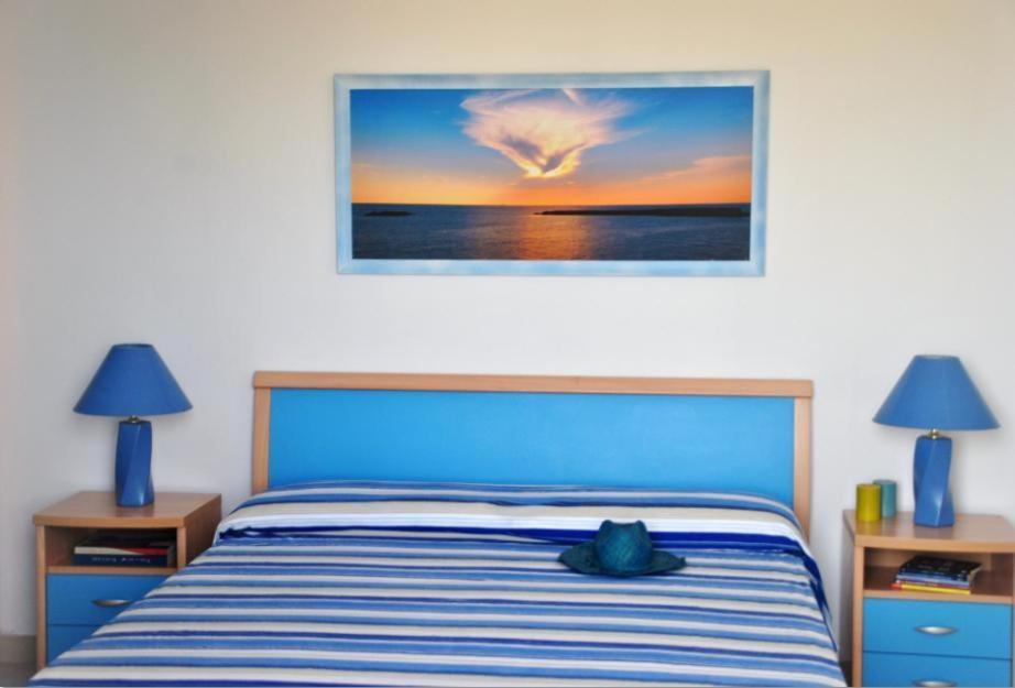 Postel nebo postele na pokoji v ubytování Residence Le Palme