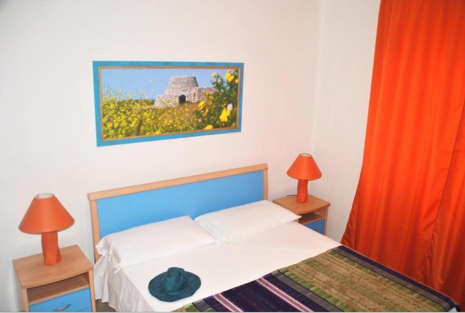 Postel nebo postele na pokoji v ubytování Residence Le Palme