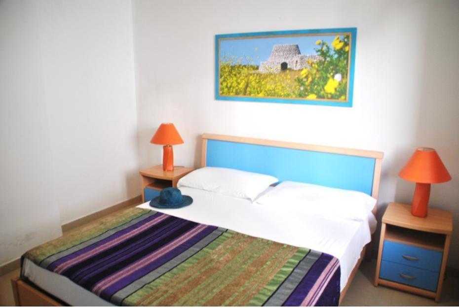 Postel nebo postele na pokoji v ubytování Residence Le Palme