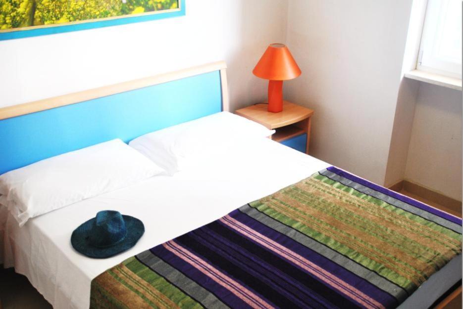 Postel nebo postele na pokoji v ubytování Residence Le Palme