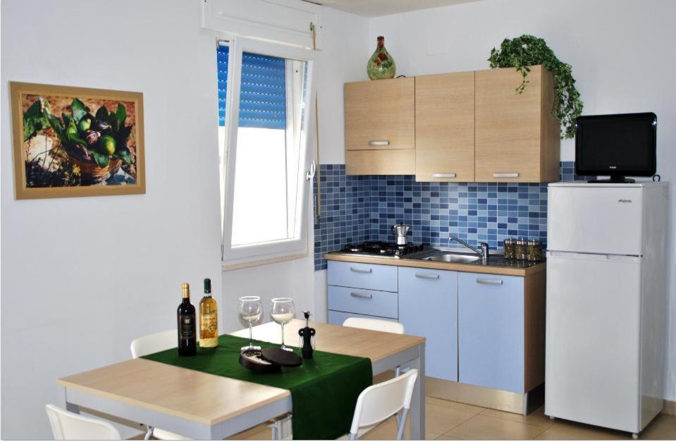 Kuchyň nebo kuchyňský kout v ubytování Residence Le Palme