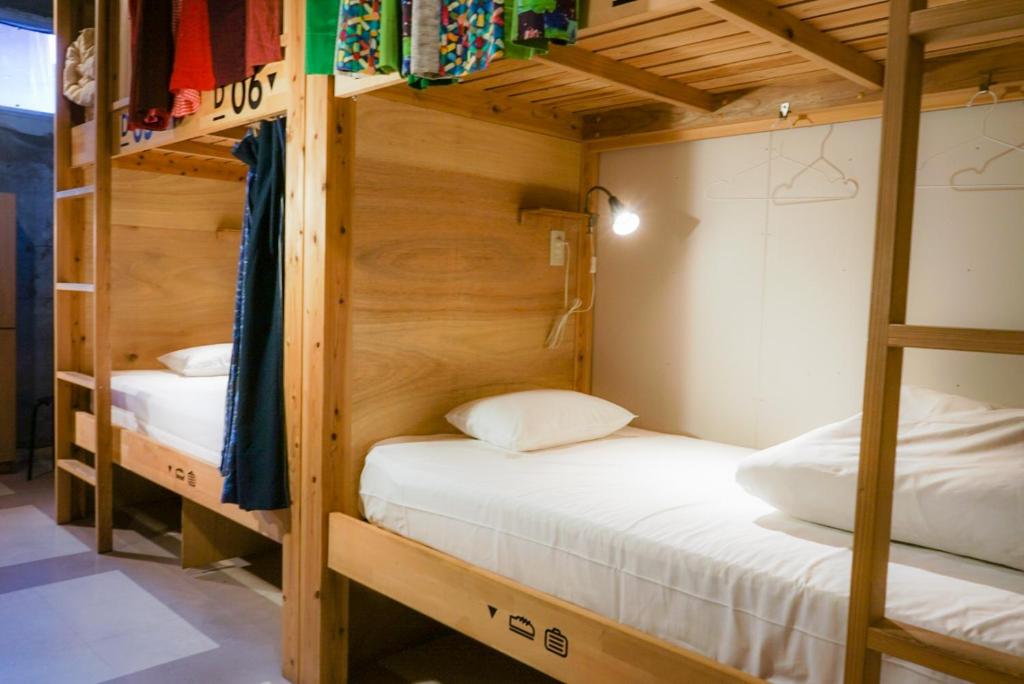 Postel nebo postele na pokoji v ubytování Hostel TangaTable