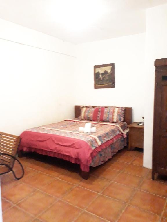 Postel nebo postele na pokoji v ubytování Griya Gribig Guest House Mitra RedDoorz