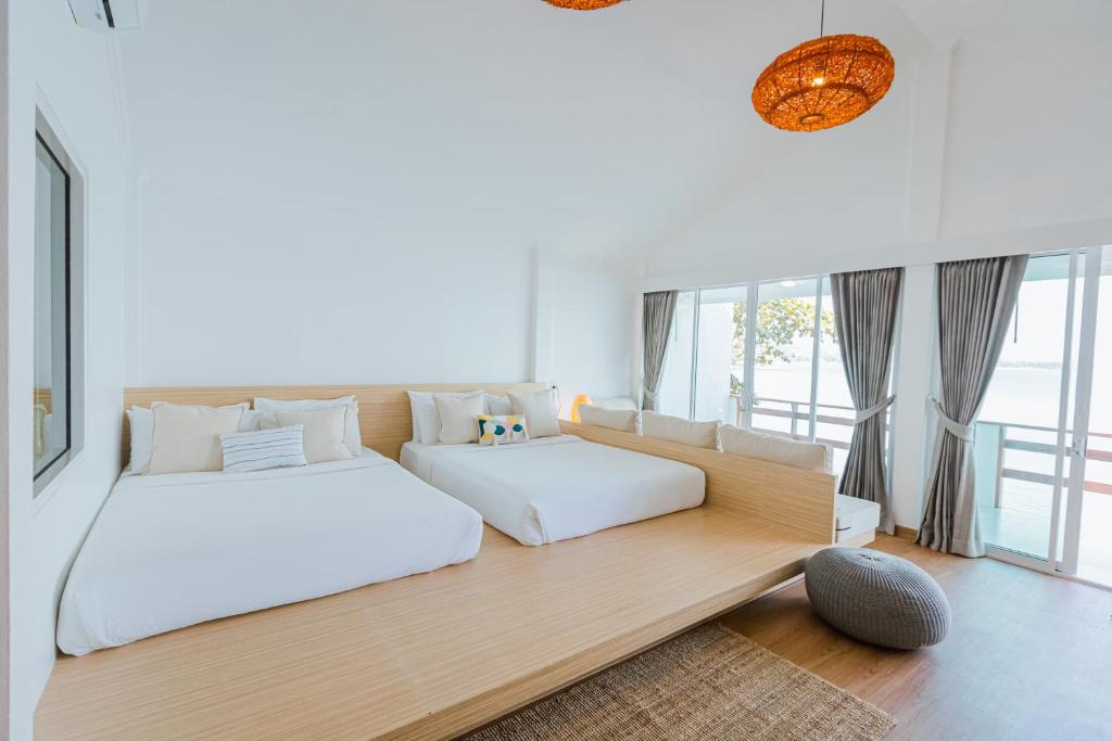 a bedroom with a bed and a couch at Vimarn Samed Resort in Ko Samed