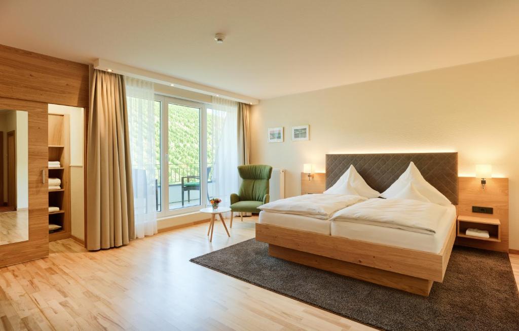Postel nebo postele na pokoji v ubytování Hotel Weis