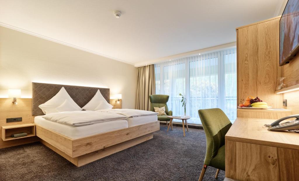 Postel nebo postele na pokoji v ubytování Hotel Weis