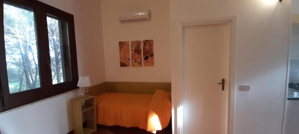 Postel nebo postele na pokoji v ubytování La Pineta
