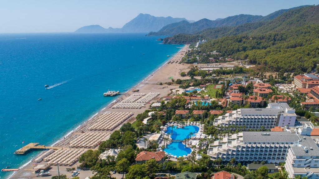 an aerial view of a beach with buildings and the ocean at Rai Premium Tekirova - Ex Queen's Park Tekirova in Tekirova