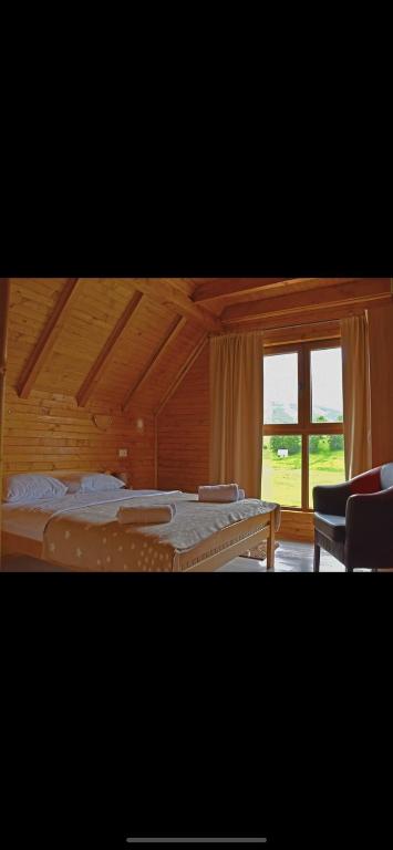Postel nebo postele na pokoji v ubytování Apartmani i Restoran Sljeme