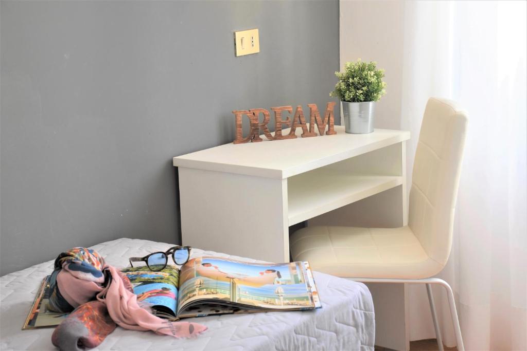 Postel nebo postele na pokoji v ubytování Hotel Delaville Frontemare