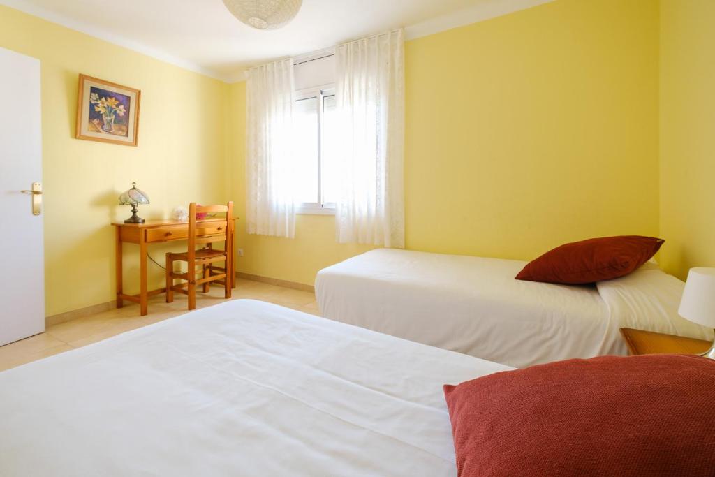 Postel nebo postele na pokoji v ubytování Apartamentos Deauville