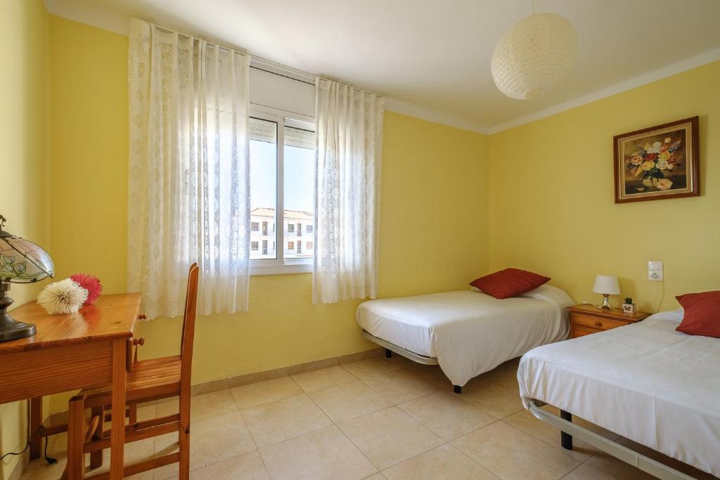 Postel nebo postele na pokoji v ubytování Apartamentos Deauville