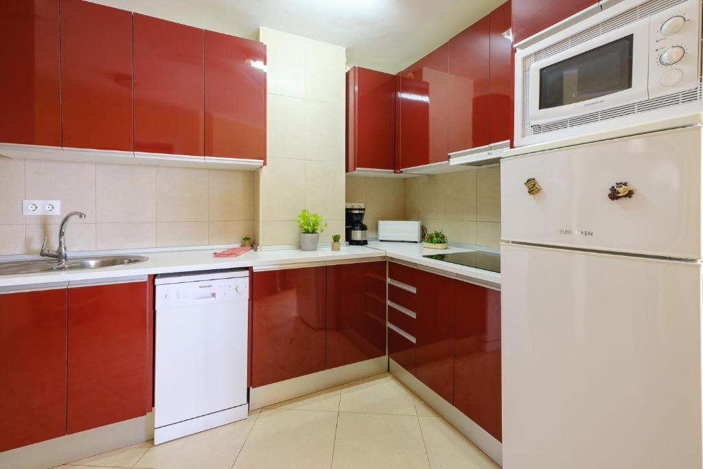 Kuchyň nebo kuchyňský kout v ubytování Apartamentos Deauville