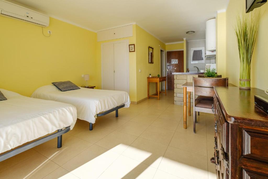 Postel nebo postele na pokoji v ubytování Apartamentos Deauville