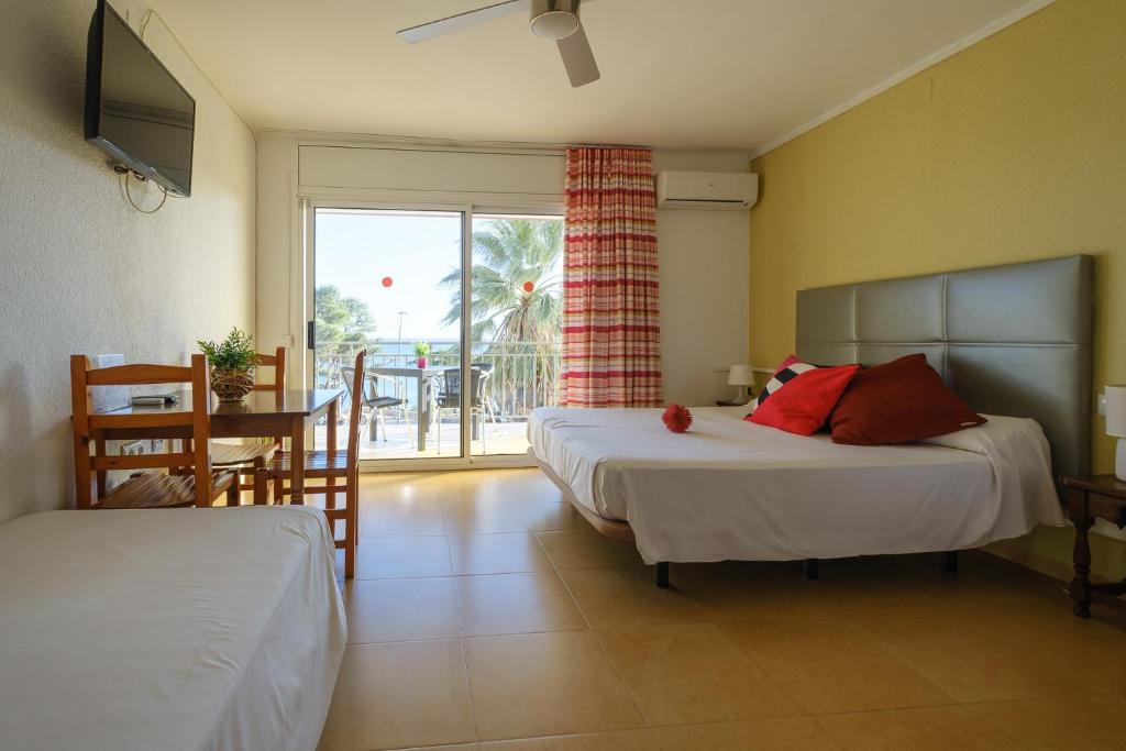 Postel nebo postele na pokoji v ubytování Apartamentos Deauville