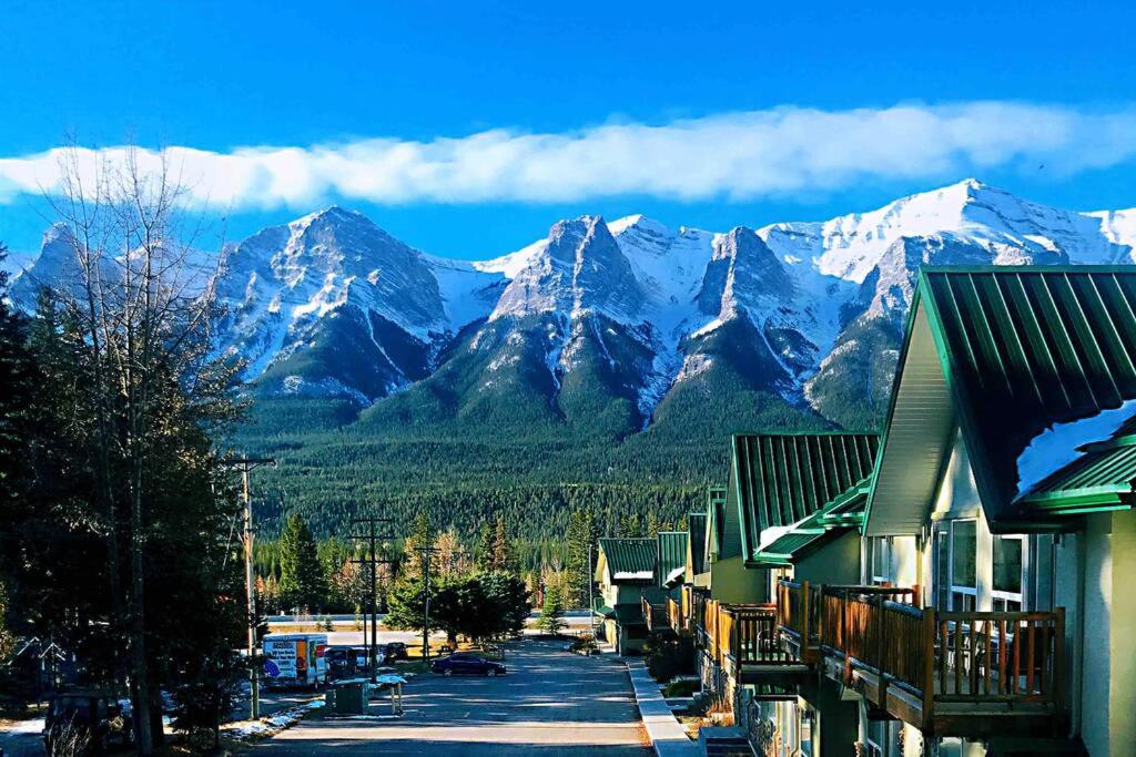 a mountain range with snow covered mountains in the distance at MountainView -PrivateChalet Sleep7- 5min to DT Vacation Home in Canmore