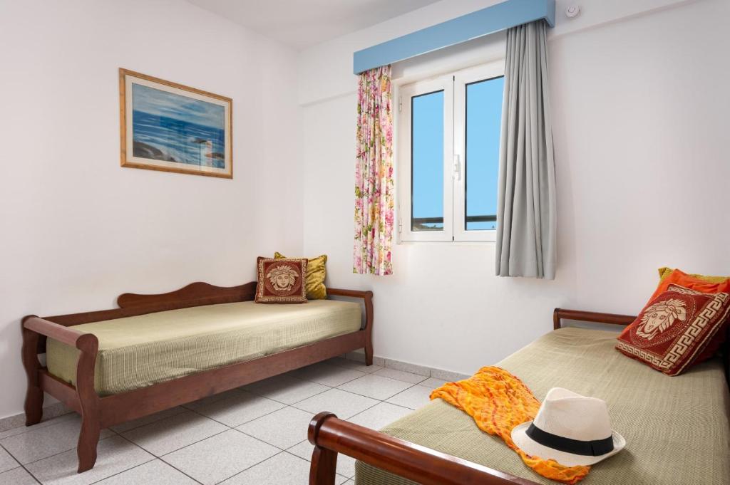 Postel nebo postele na pokoji v ubytování Bellos Hotel Apartments
