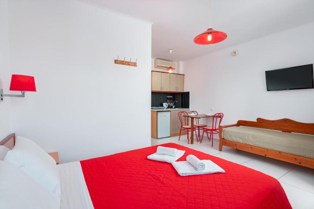 Postel nebo postele na pokoji v ubytování Bellos Hotel Apartments