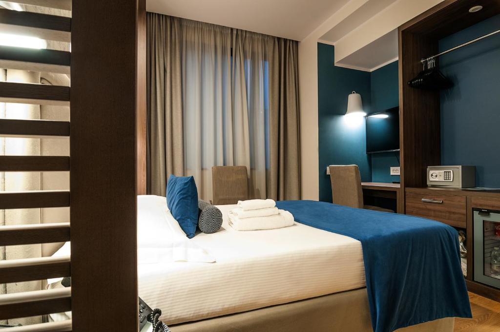 Postel nebo postele na pokoji v ubytování Fly Decó Hotel