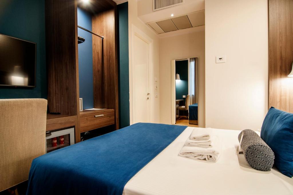 Postel nebo postele na pokoji v ubytování Fly Decó Hotel