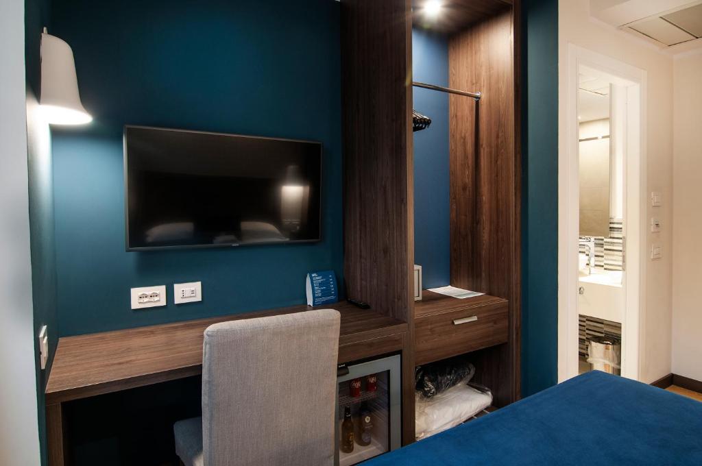 TV a/nebo společenská místnost v ubytování Fly Decó Hotel