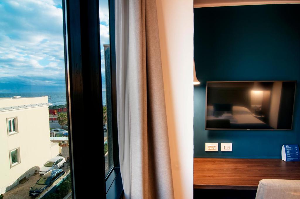 Postel nebo postele na pokoji v ubytování Fly Decó Hotel