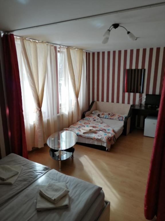 Postel nebo postele na pokoji v ubytování Guest House Tsenovi