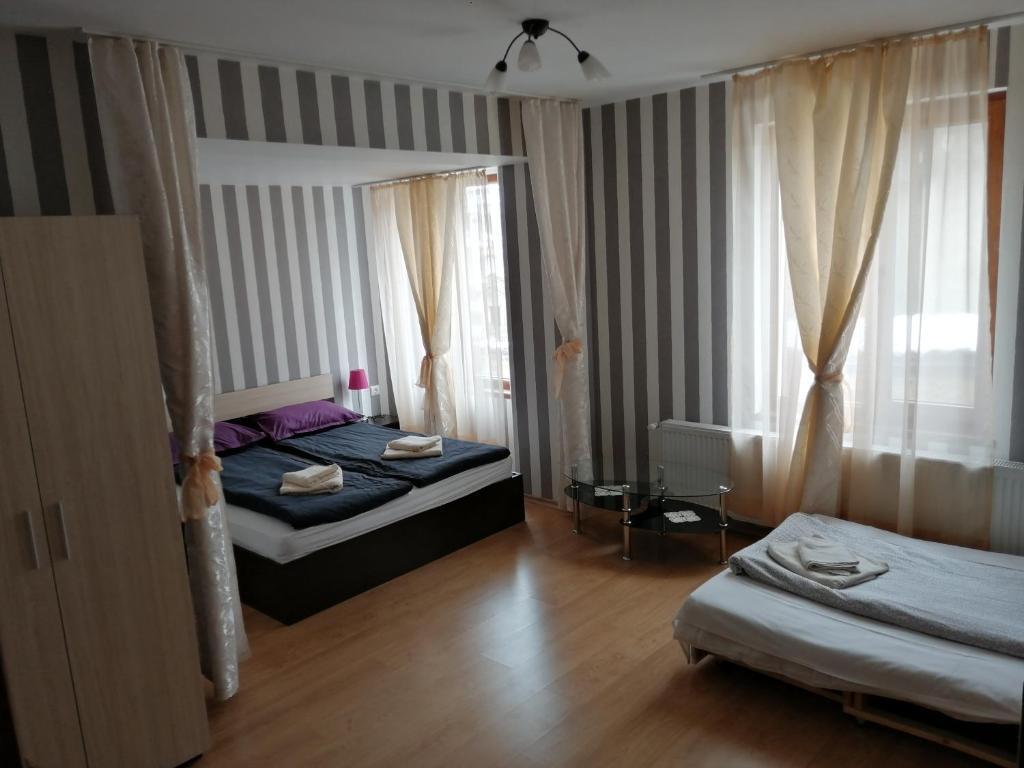 Postel nebo postele na pokoji v ubytování Guest House Tsenovi