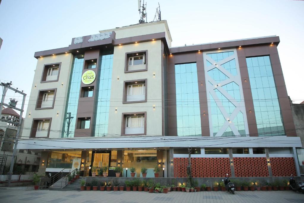 a building with a clock on top of it at Citrus Prime Raipur in Raipur