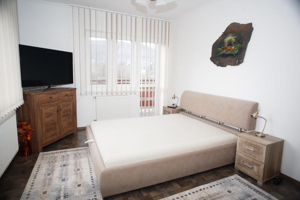 מיטה או מיטות בחדר ב-Ágnes vendégház Teljes ház