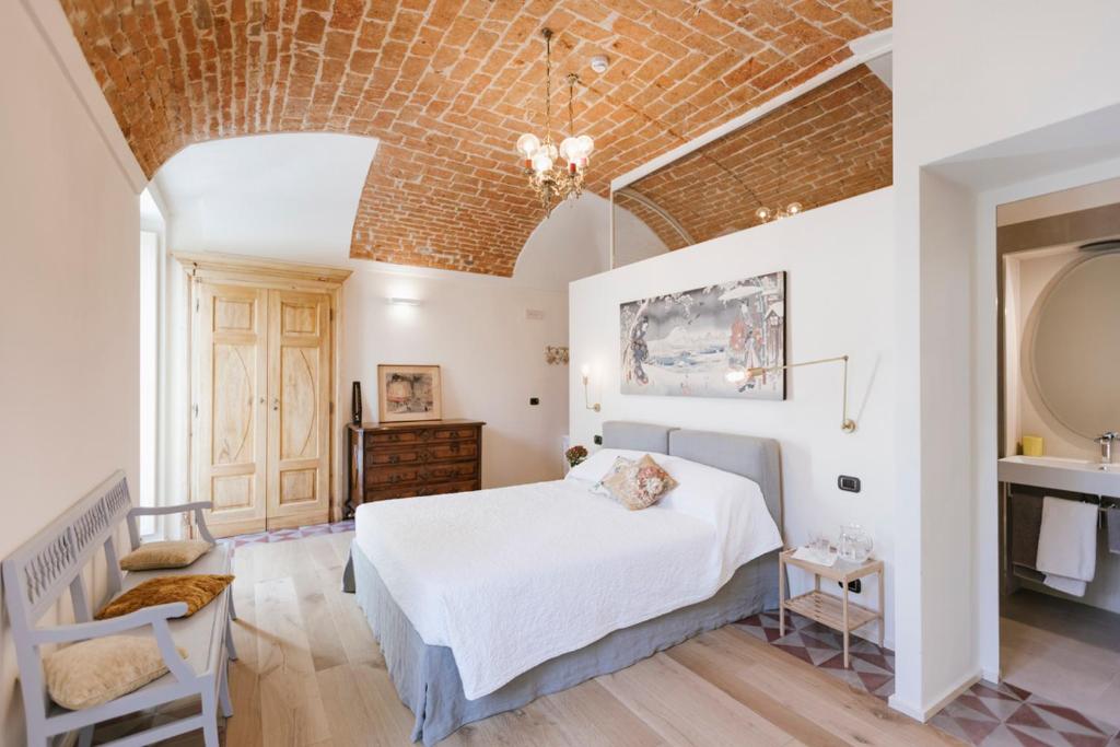 Postel nebo postele na pokoji v ubytování Villa Trisano