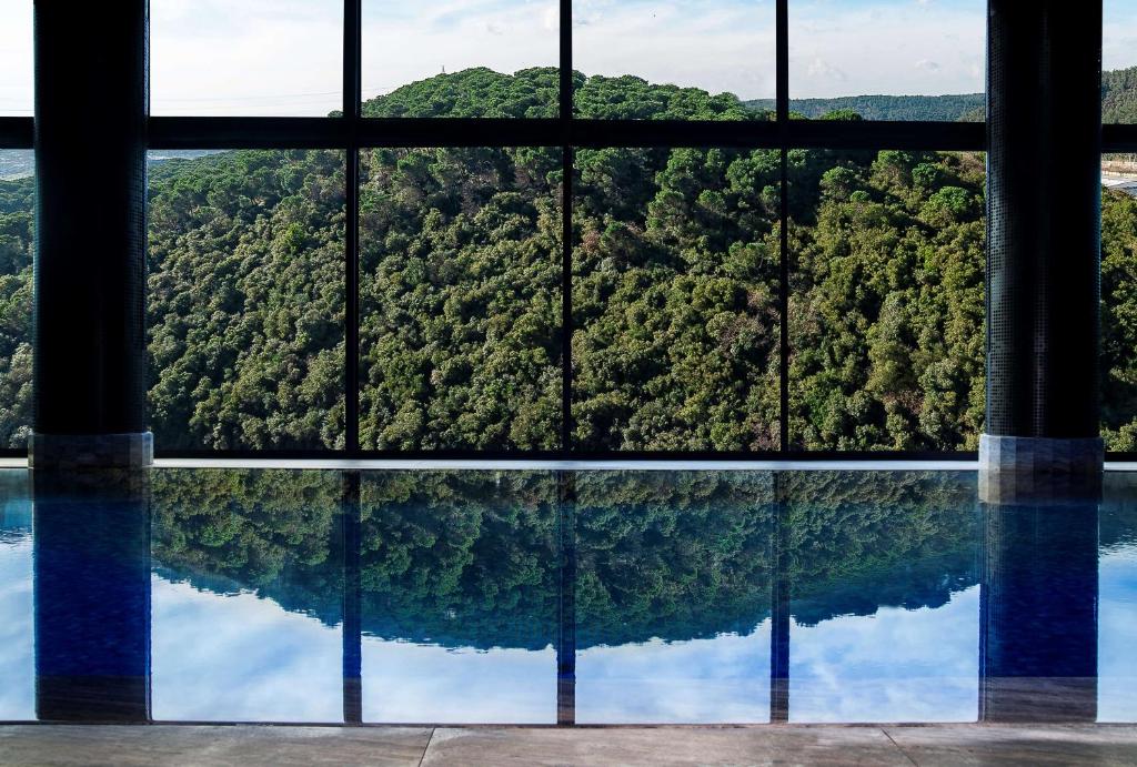 a view of a mountain through a window at Radisson Collection Hotel, Vadistanbul in Istanbul