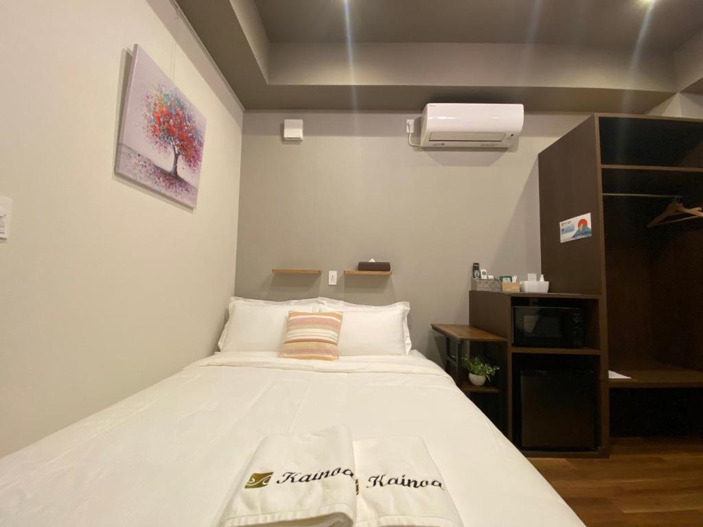 Postel nebo postele na pokoji v ubytování Kainoa Guesthouse