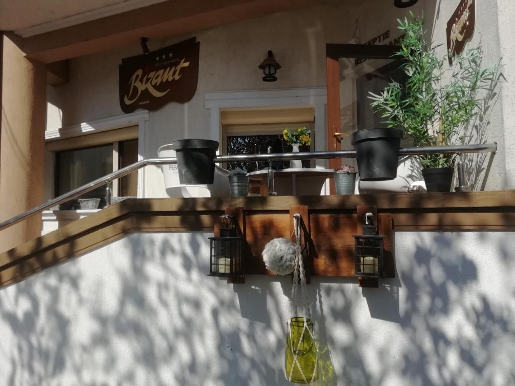 a swimming pool in front of a restaurant at Bizant Boutique in Bacău