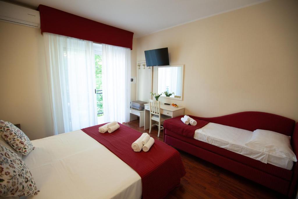 Postel nebo postele na pokoji v ubytování Hotel Maestri